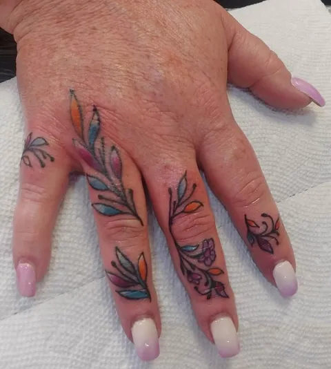 Colored leaves and vines down the fingers
