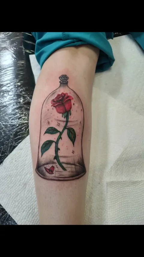 A red rose under a glass dome on the leg, in color