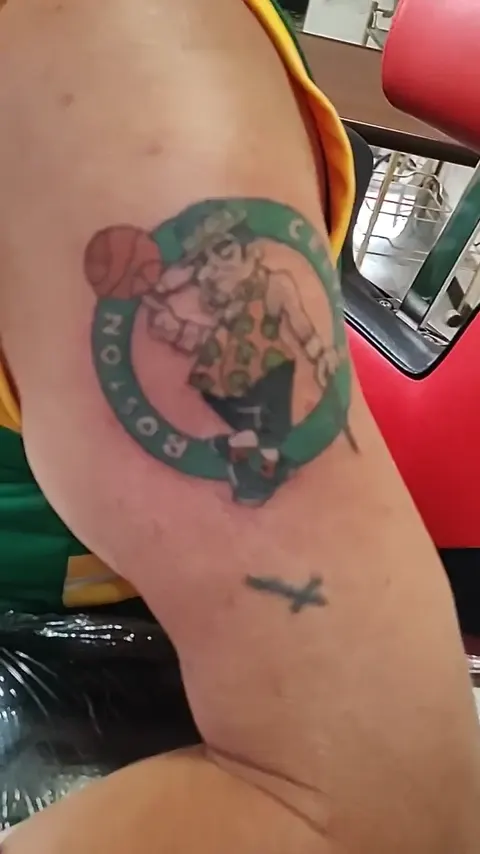 The Boston Celtics leprechaun on the upper arm, in color