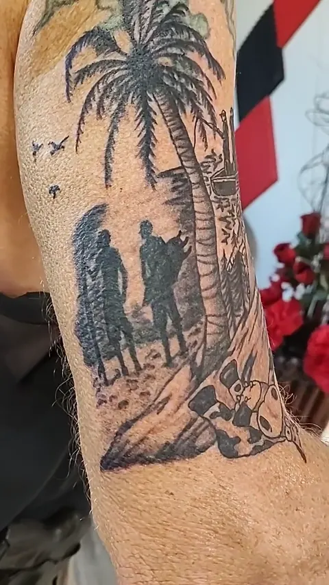 Palm trees, a sun and a couple walking the beach around the upper arm